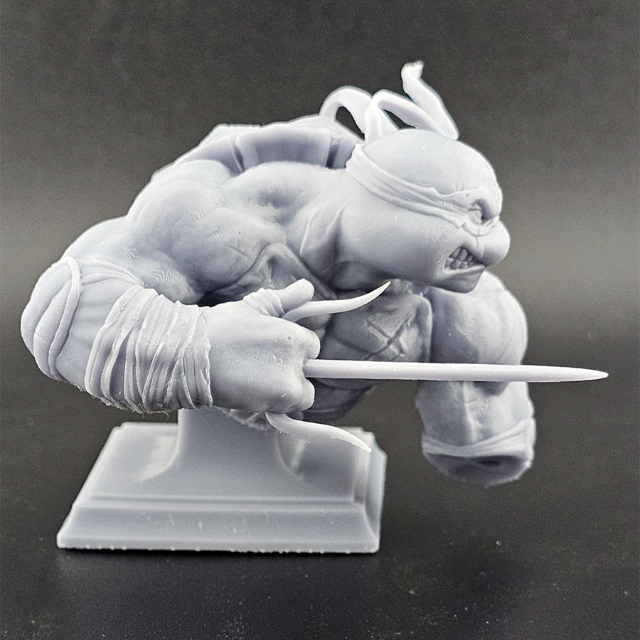 Unpainted 1/9 scale Raphael resin bust kit featuring detailed sculpting of the TMNT character, ready to assemble and paint.