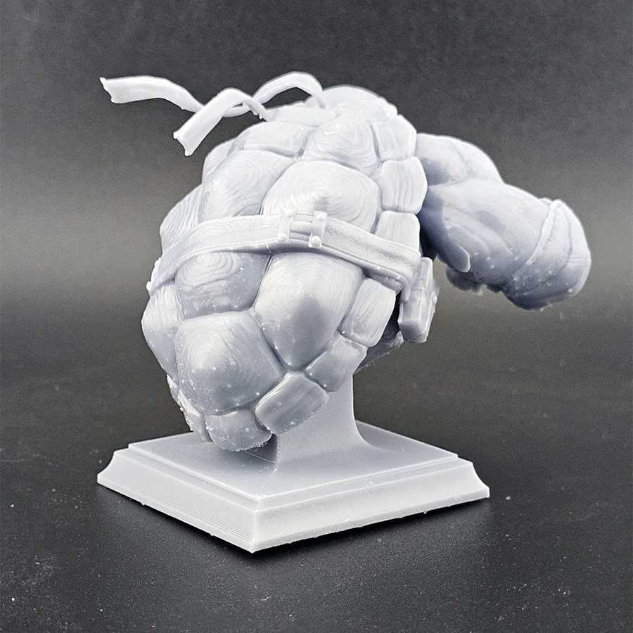 Unpainted 1/9 scale Raphael resin bust kit featuring detailed sculpting of the TMNT character, ready to assemble and paint.