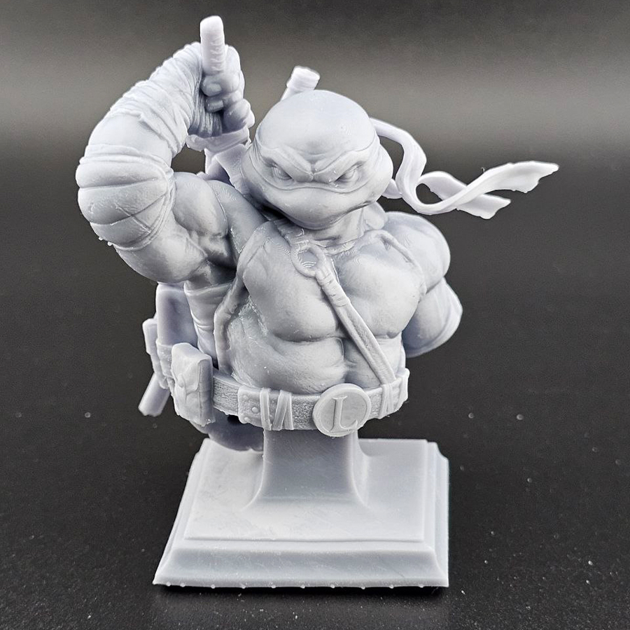 Unpainted 1/9 scale Leonardo bust 3D print in grey resin, shown assembled for display.