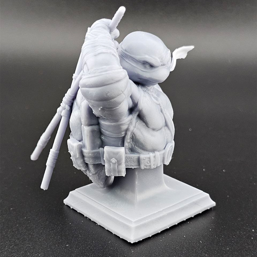 Unpainted 1/9 scale Leonardo bust 3D print in grey resin, shown assembled for display.