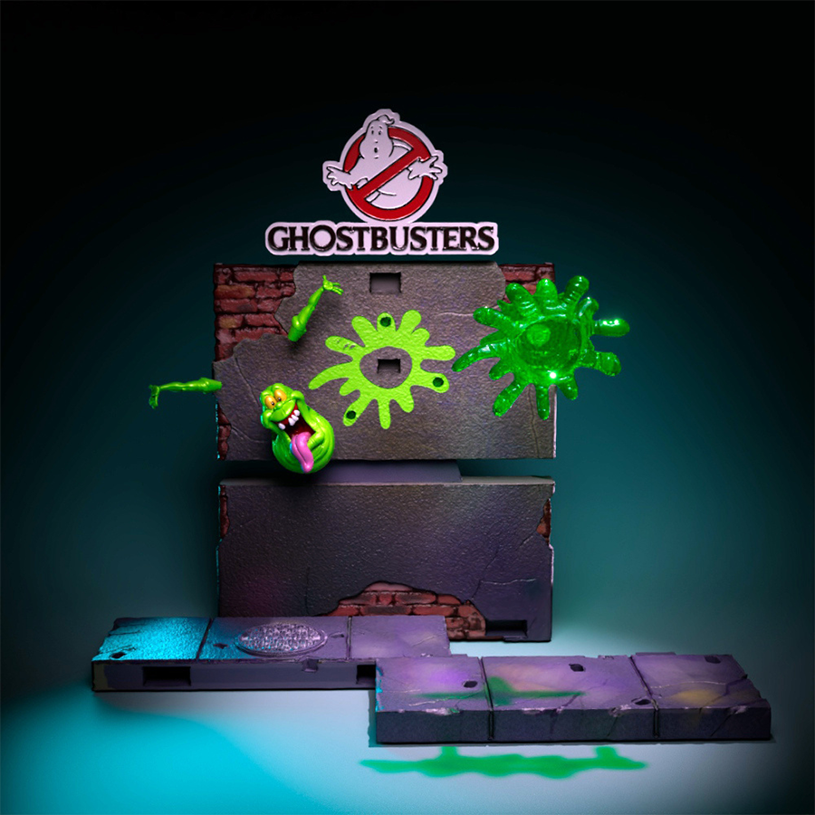 Full Real Ghostbusters diorama with all four characters, city base, Slimer busting through wall, and Ghostbusters logo on top