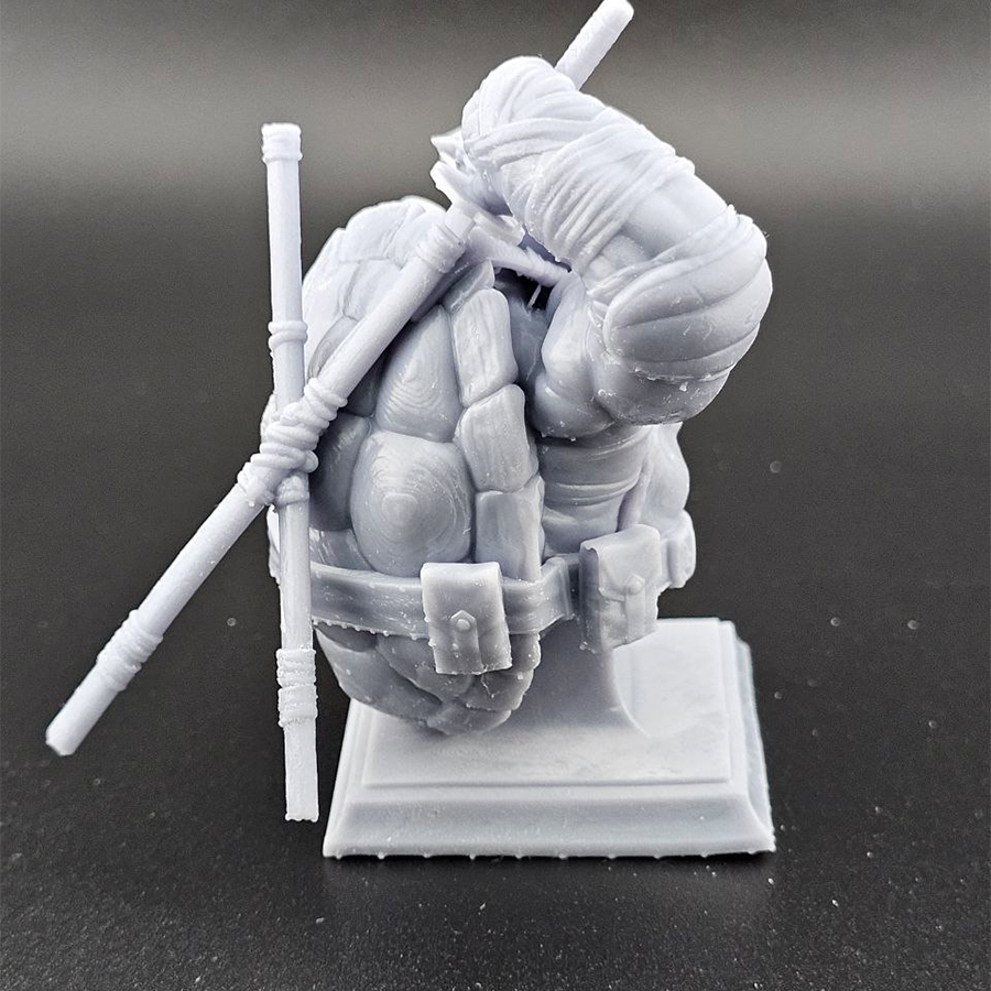 Unpainted 1/9 scale Leonardo bust 3D print in grey resin, shown assembled for display.