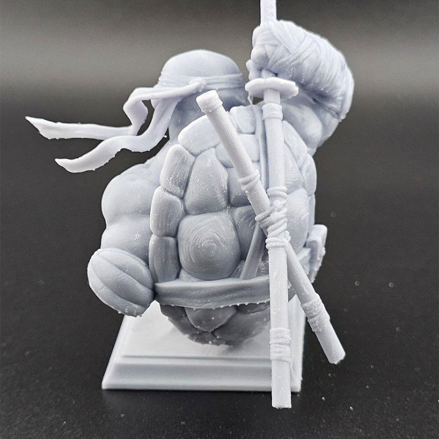 Unpainted 1/9 scale Leonardo bust 3D print in grey resin, shown assembled for display.