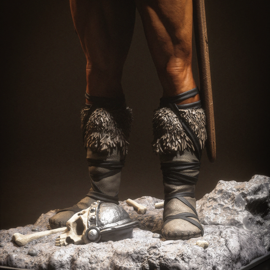 Resin figure of Conan the Barbarian holding a sword upright on a rocky base