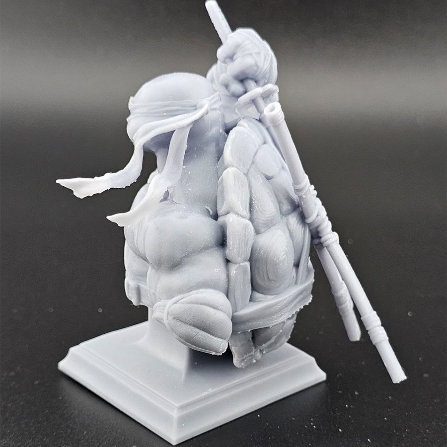 Unpainted 1/9 scale Leonardo bust 3D print in grey resin, shown assembled for display.