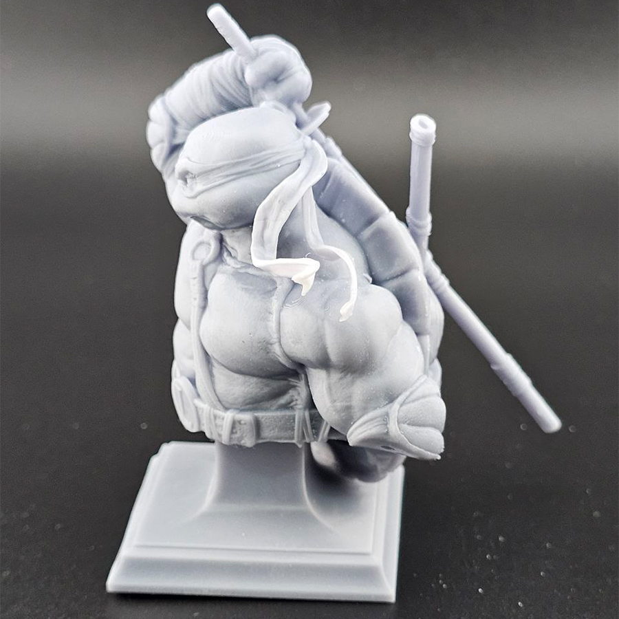 Unpainted 1/9 scale Leonardo bust 3D print in grey resin, shown assembled for display.