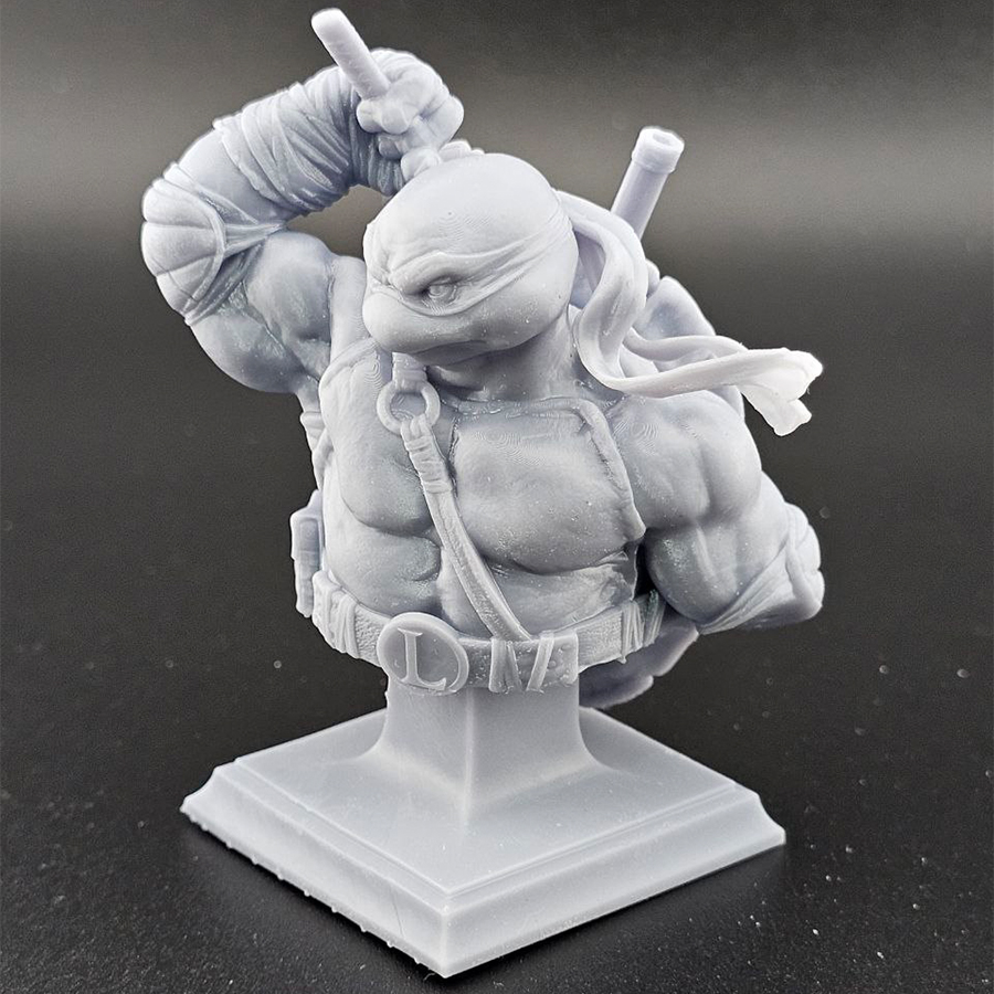 Unpainted 1/9 scale Leonardo bust 3D print in grey resin, shown assembled for display.