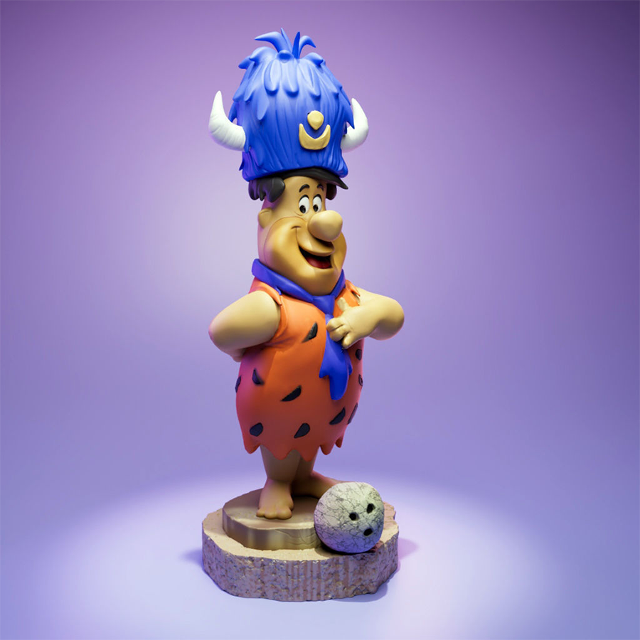 Fred Flintstone resin figure with lodge hat and bowling ball on a themed base