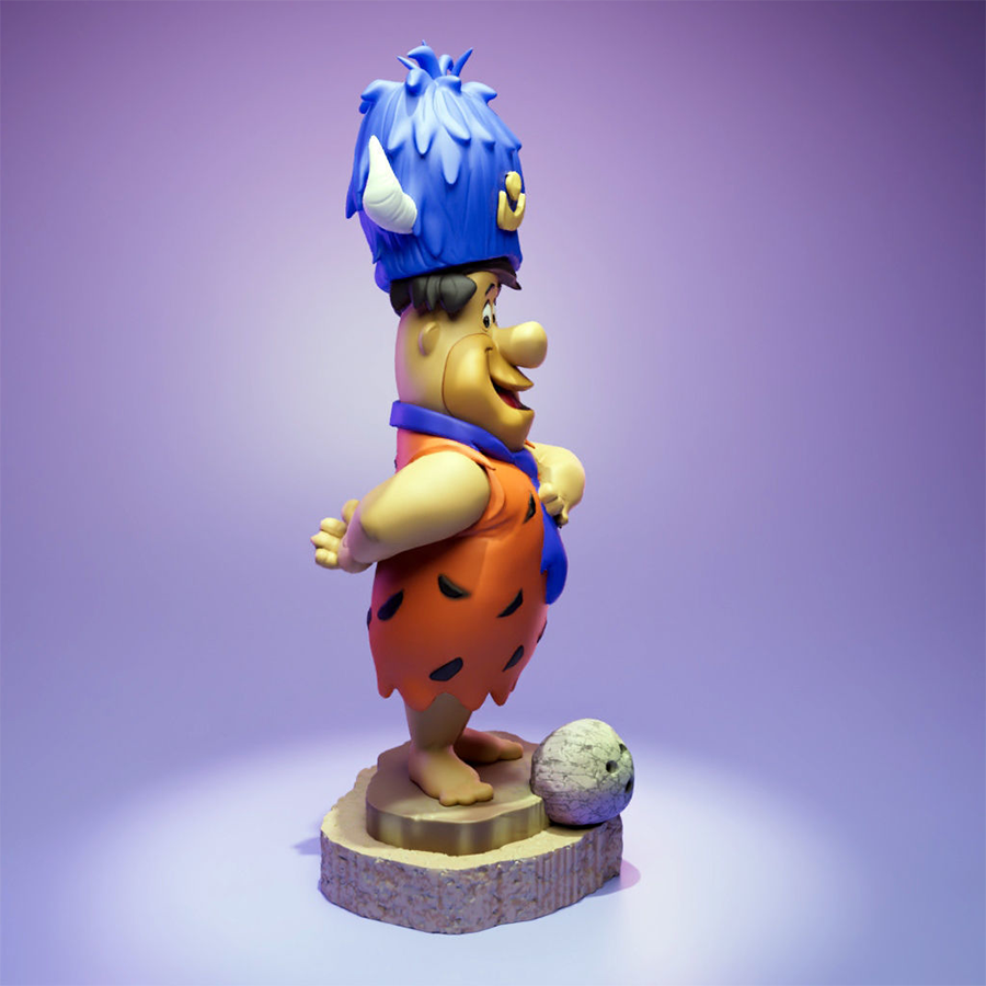 Fred Flintstone resin figure with lodge hat and bowling ball on a themed base