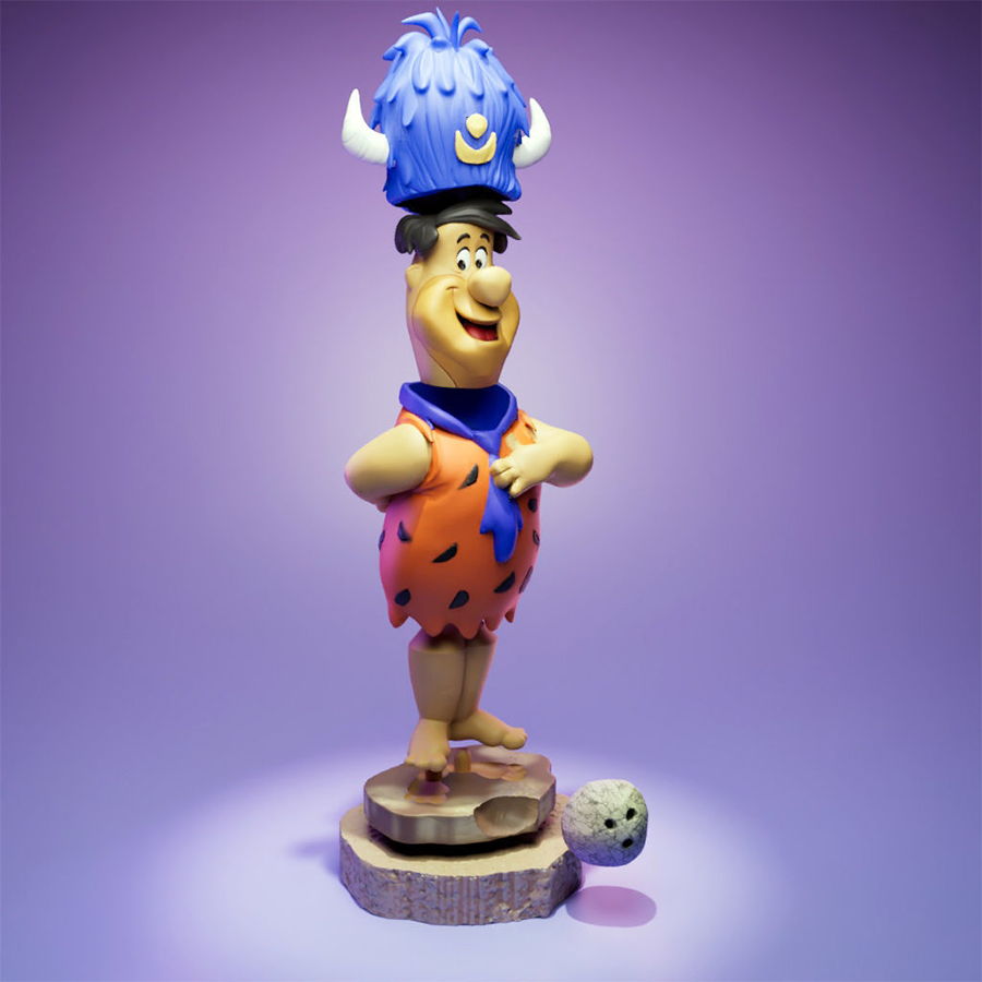 Fred Flintstone resin figure with lodge hat and bowling ball on a themed base