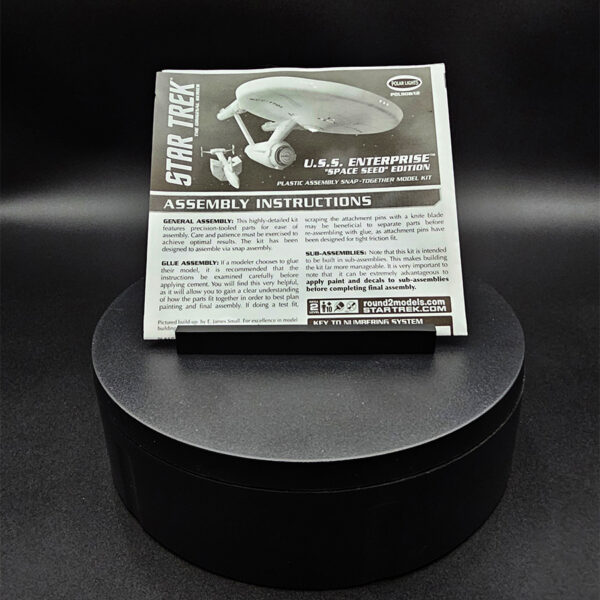 Open-box 1/1000 scale Polar Lights USS Enterprise NCC-1701 with Botany Bay model kit. Includes all parts, decals, and instructions. Missing dome base and display rod.