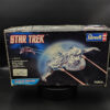 Open box AMT ERTL Star Trek 1/323 scale model kit previously worked on for lighting with missing clear window parts and missing part 9
