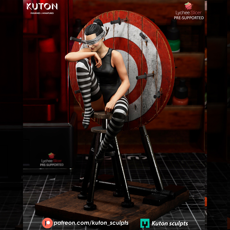 Blind Trust 1/10 scale resin figure by Kuton Sculpts seated on a stool with a target backboard display base