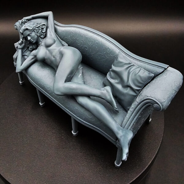 1/10 scale resin figure on detailed couch with pillows, unpainted and unassembled, clearance item.