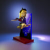 Bewitched resin figure printed by HLI3DFX, sculpted by UEL Winner, featuring a witch on a broom in front of a moonlit skyline backdrop with logo display base