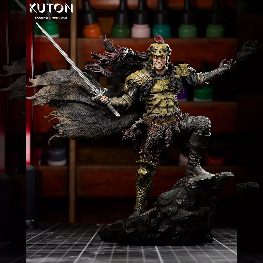Kurgan 3D printed resin figure by Kuton Sculpts charging with a sword, wearing battle armor and a flowing cape on a rocky base