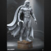 Moon Knight unpainted resin figure with flowing cape and crescent blades on a round pedestal base.