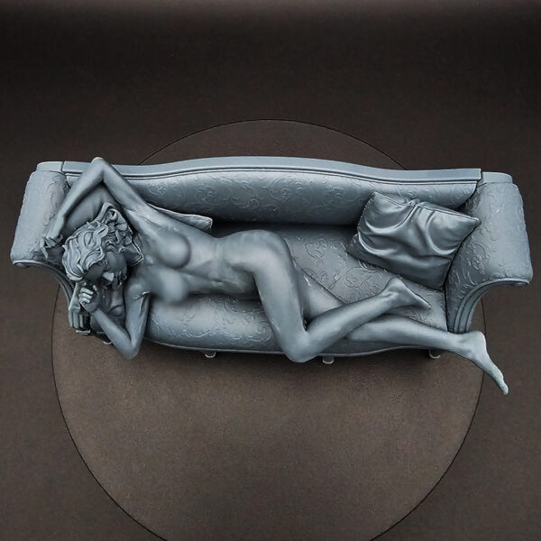 1/10 scale resin figure on detailed couch with pillows, unpainted and unassembled, clearance item.