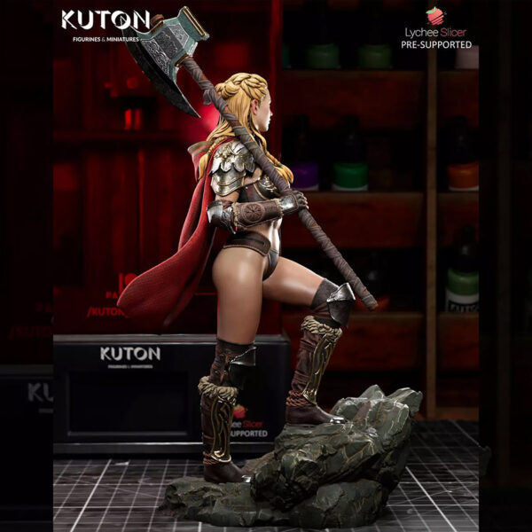 Eydis Thorne resin print by Kuton Sculpts with fantasy armor, cape, and battle axe on a rocky base