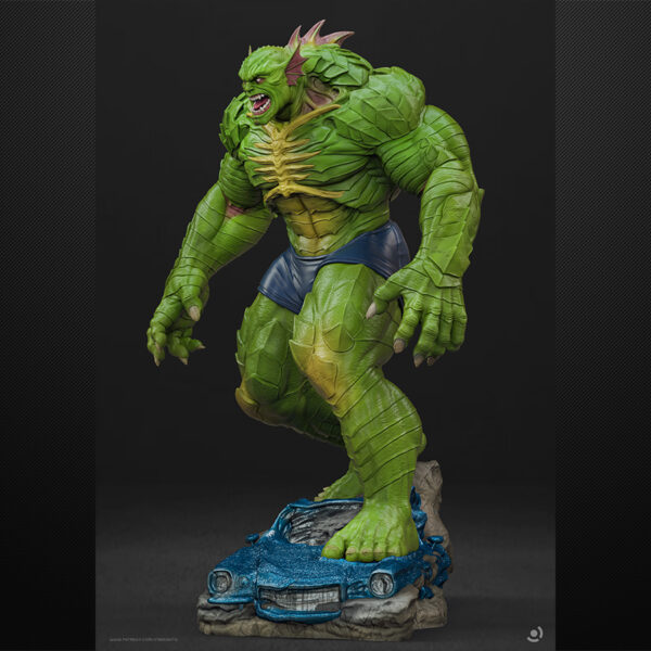 Abomination unpainted resin monster figure on a rocky base with flowing slime effect.