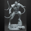 Omega Red unpainted resin figure with extended coils on an industrial-style base.