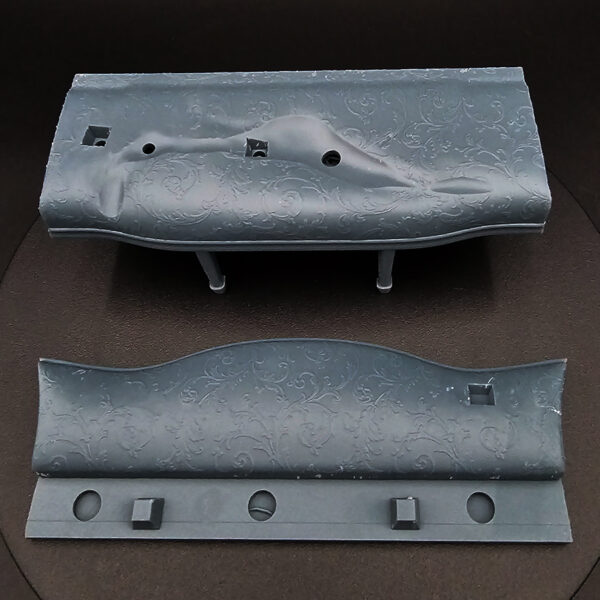 1/10 scale resin figure on detailed couch with pillows, unpainted and unassembled, clearance item.