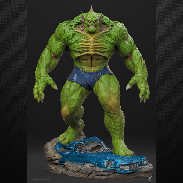 Abomination unpainted resin monster figure on a rocky base with flowing slime effect.