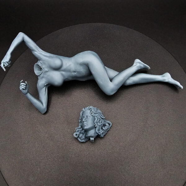 1/10 scale resin figure on detailed couch with pillows, unpainted and unassembled, clearance item.